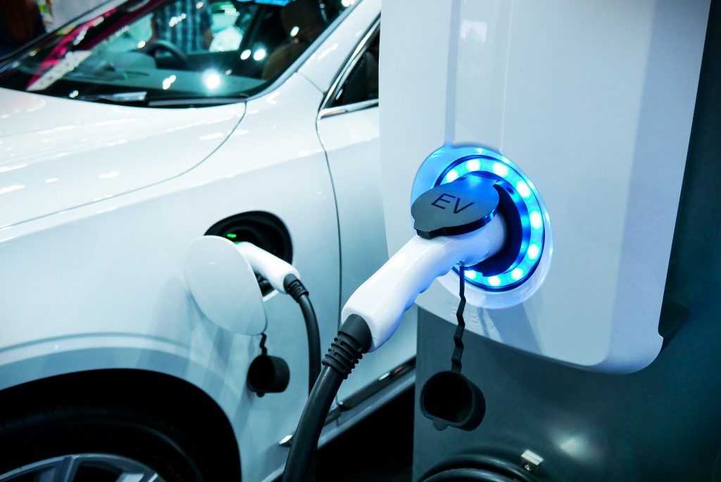 charging a white electric car