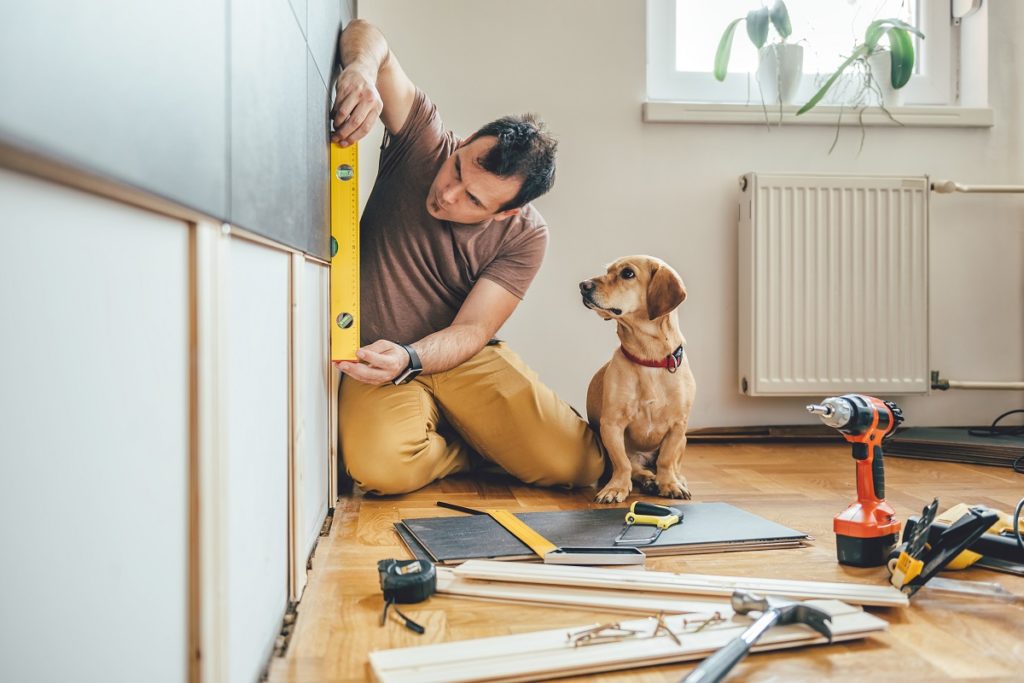 A carpenter with a dog