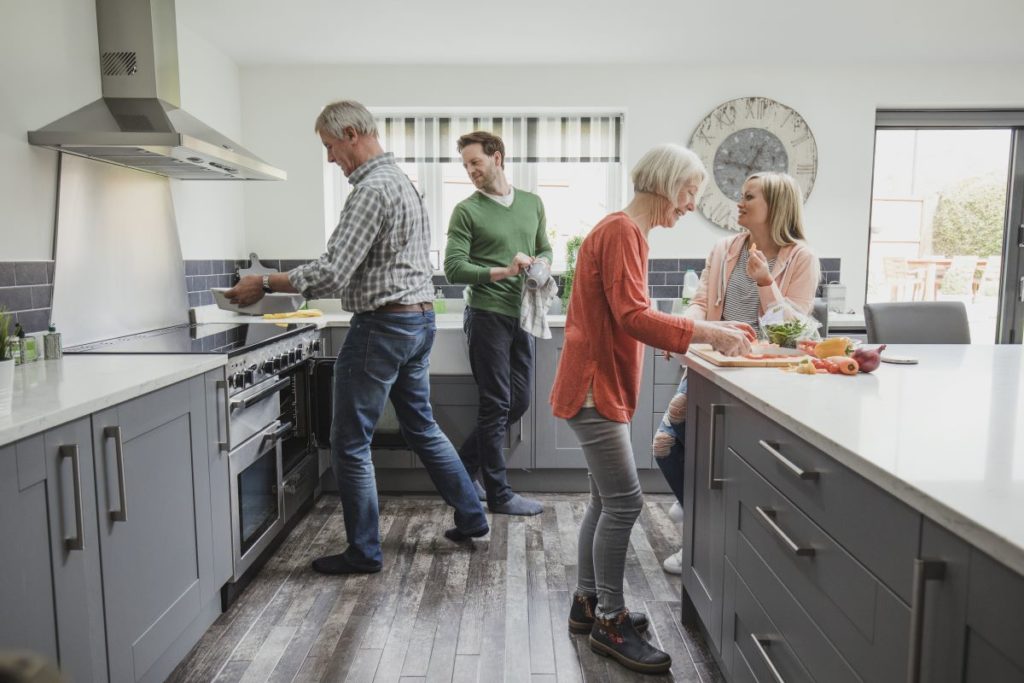 adult and elders cooking in the kitchen
