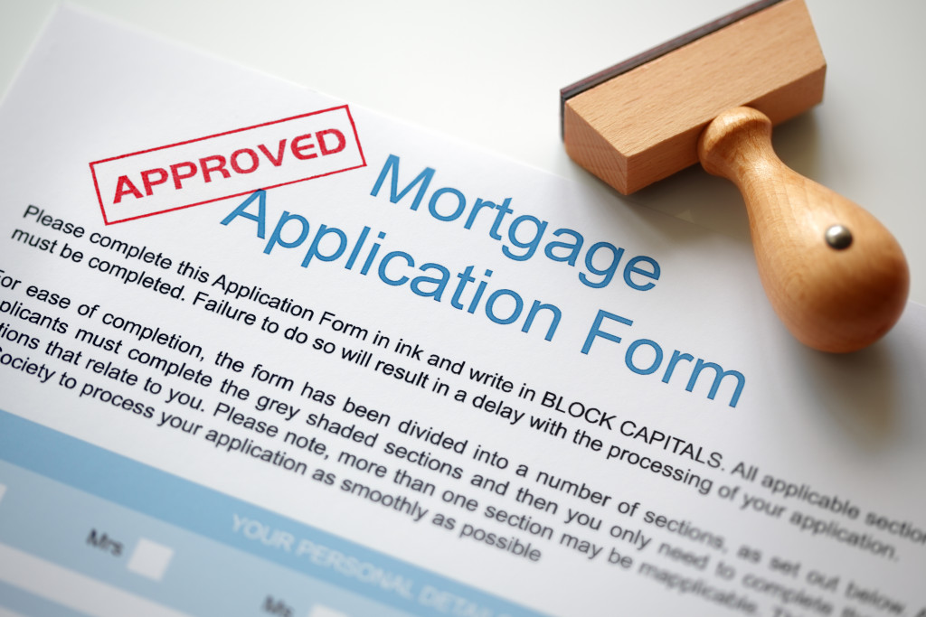 a photo of a mortgage application form with approved stamp